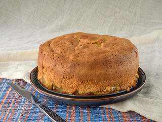 Cup of black tea.And Apple sponge cake.