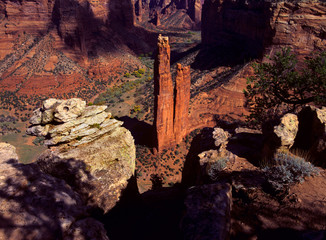Spider Woman Rock rises steeply above the floor of Canyon de Chelly, Arizona, USA.