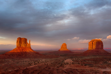 Fototapeta na wymiar Arizona, Monument Valley, West Mitten, East Mitten, and Merrick Butte, sunset