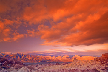 Fototapeta premium USA, California. View from Zabriske Point of Death Valley National Parkstorm clouds at sunrise. 