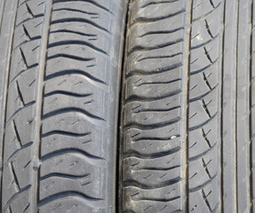 The background of the tread pattern of the car wheel. Rubber tir