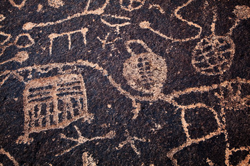 USA, California, Owens Valley. Petroglyphs cover boulder. 