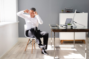 Happy Businessman Stretching