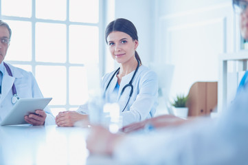 Doctors consulting with each other in a hospital conference room