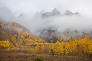 USA, Colorado, Aspen. Sievers Mountain with clouds swirling among its spires above the Maroon Valley. 