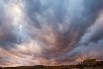 USA, Colorado, San Juan Mountains. Storm clouds at sunset. 