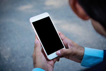 Close up Man holding mobile smartphone