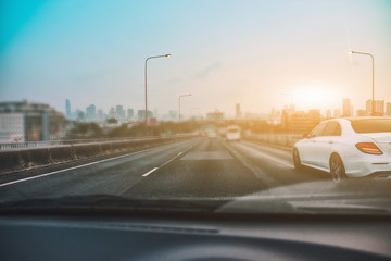 Car Driving on road and Small passenger car seat on the road used for daily trips