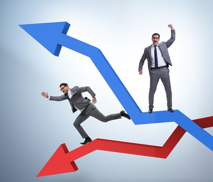 Businessman with charts of growth and decline