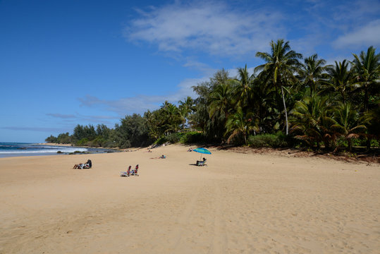 Sunbathers at Ha'ena State Park, Ke'e Beach on Northshore of Kauai, Hawaii
