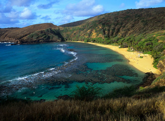Beautiful turquoise Hanauma Bay shimmers near Honolulu on Oahu in Hawaii.