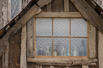 USA, Idaho, Idaho City. Old building with dusty bottles in window. 