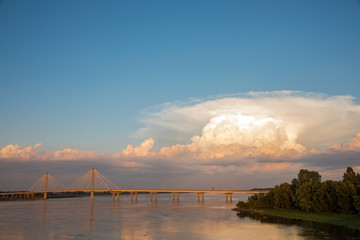 Fototapeta na wymiar Clark Bridge over Mississippi River and thunderstorm (Cumulonimbus Cloud), Alton, Illinois
