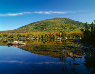 Fototapeta premium USA, Maine, Baxter State Park, South Turner Mountain with early autumn color reflects in Sandy Stream Pond.