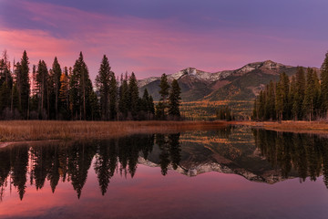 Swan Mountains reflecting into Holland Lake in the Flathead National Forest, Montana, USA