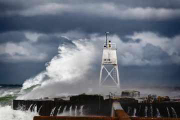 Grand Marais Light and storm driven waves of Lake Superior crashing, Grand Marais, Michigan, Upper...