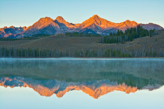 Alpenglow, sunrise, reflections, Little Redfish Lake, Sawtooth National Forest, Stanley, Idaho