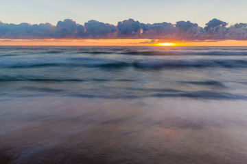 Dawn over the Atlantic Ocean at Coast Guard Beach in the Cape Cod National Seashore in Eastham, Massachusetts.
