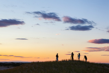 Photographers atop the Provinceland Dunes in Cape Cod National Seashore in Provincetown, Massachusetts.