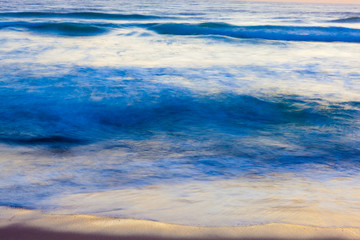 Early morning light reflects in the surf at Coast Guard Beach in the Cape Cod National Seashore in Eastham, Massachusetts.