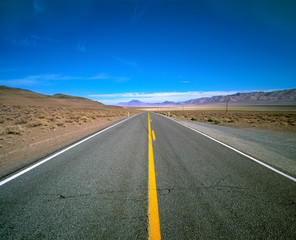 Fototapeta na wymiar USA, Nevada, Lerlach. Highway 447 near Gerlach in Nevada runs through a desolate part of the country.