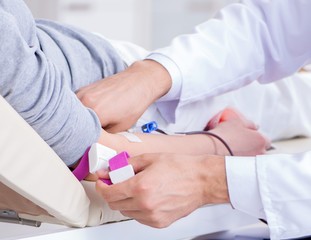 Patient getting blood transfusion in hospital clinic