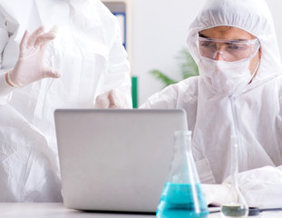 Two chemists working in the lab