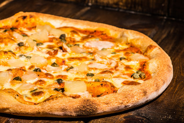 Fresh pizza made in a small bakery