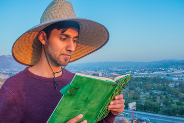 Fototapeta premium adventurers reading a mystical green book