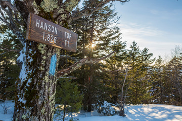 The sign marking Hanson Top on Green Mountain in Effingham, New Hampshire. Winter.