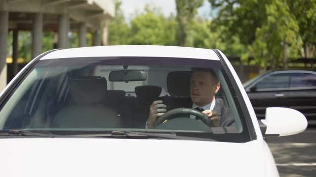 Man drinking beer driving car and bumping into pedestrian in city street