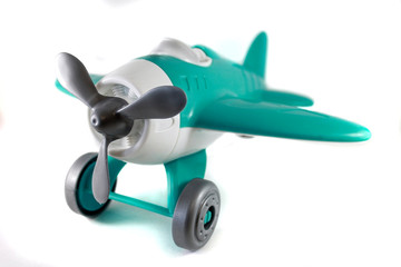 toy airplane with a propeller, on wheels, azure, white, gray, without a pilot