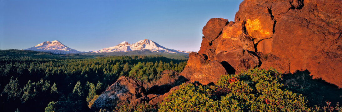 USA, Oregon, Three Sisters. Three Sisters take on a pink hue at sunrise, Cascades Range, Oregon.
