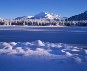 USA, Oregon, Broken Top. A soft, lumpy snow field is highlighted by morning light near Broken Top, Cascades Range, Oregon.