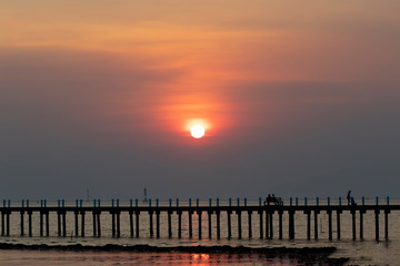 Fototapeta na wymiar Sunset on the sea Sunset sea landscape nature bridge Beach by the sea