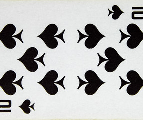 Playing card ten peak, suit of spades.