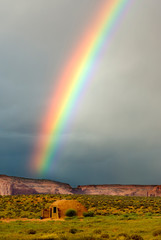 USA, Utah, Monument Valley Navajo Tribal Park. Rainbow over a Navajo hogan. - obrazy, fototapety, plakaty
