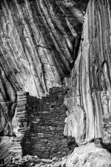 USA, Utah. Black and white image of unnamed Cedar Mesa ruin and Canyon Wall