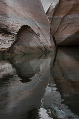 Usa, Utah, Glen Canyon National Recreation Area. Rock formations near Cathedral in the Desert with canyon wall reflections emerged from the lowering water level of Lake Powell.