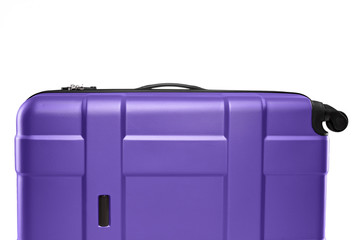 Fragment of purple plastic valise on wheels isolated on white background