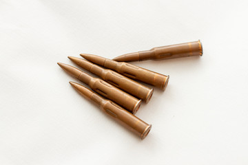 ammunition for a firearm machine gun on white background