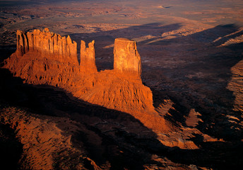 USA, Utah, Monument Valley. Sunset creates long shadows of the buttes in Monument Valley, Utah, as seen from a small plane.