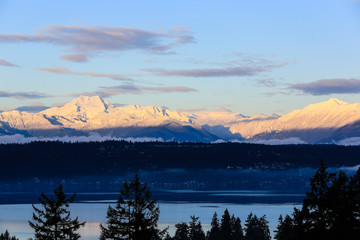 Bremerton, Washington State. Snow covered Brothers Mountain and the Olympics over the Puget Sound bay