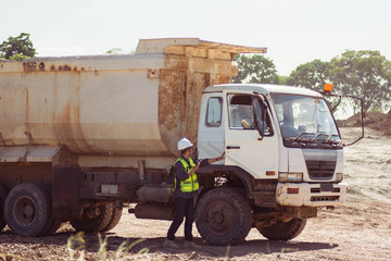 Field engineer officer give instruction to truck driver mine field worker on mining site