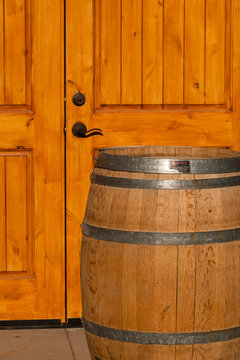 USA, Washington, Lake Chelan. Morning Light On Winery Door And Barrel.