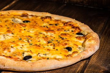 Fresh pizza made in a small bakery