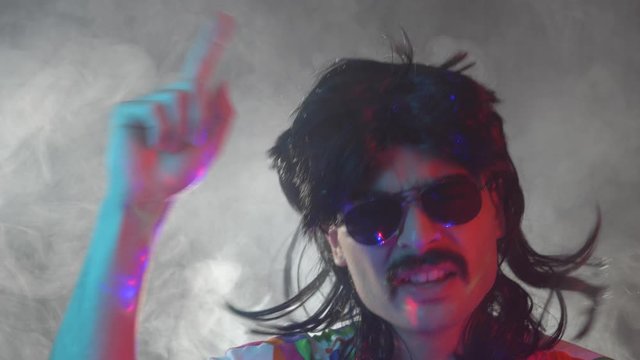 Man with mustache and mullet from the 70s 80s 90dancing in a party. Vintage concept.