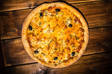 Fresh pizza made in a small bakery
