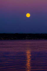 USA, Washington State, Kingston. The super moon illuminates the Puget Sound waterway.
