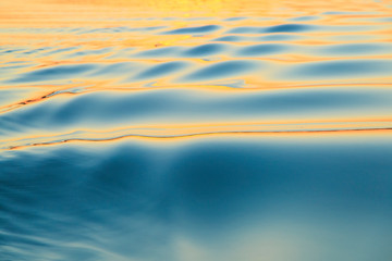 Naklejka na ściany i meble Sunset reflecting on smooth surface and small ripples, Moses Lake, Washington State, USA